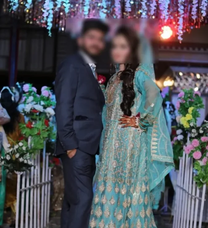 Newlywed couple celebrating in traditional wedding attire